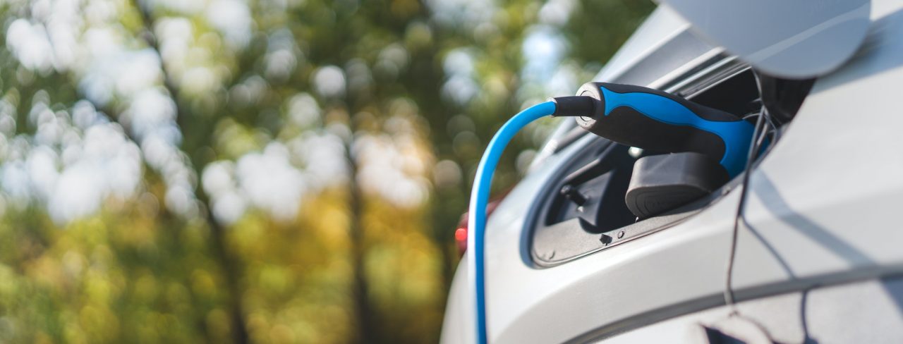 charging an electric car sustainable transportation concept